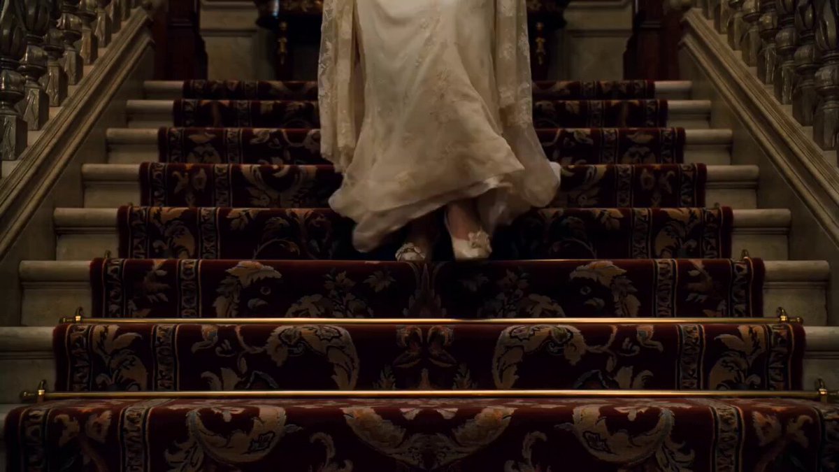 Gothic Mystery: Woman Descends Staircase