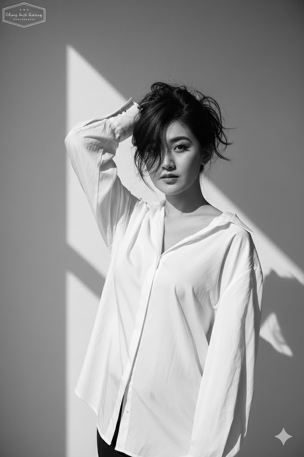 Bold Expressive Black & White Portrait in Loose White Blouse