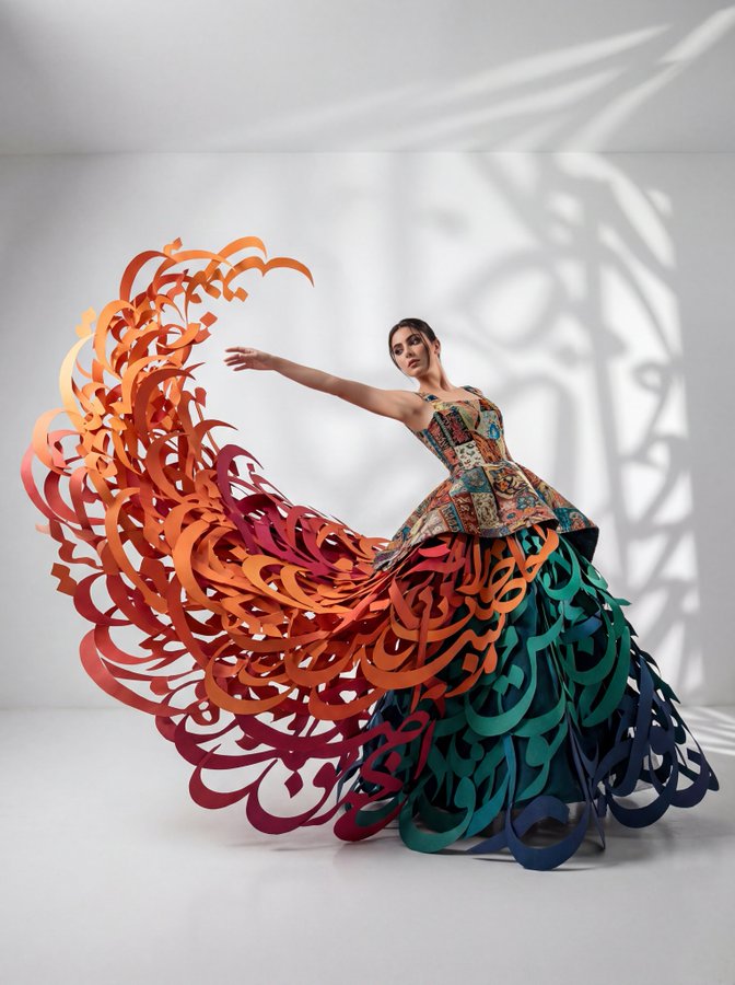 Woman in Avant-Garde Gown of Giant 3D Paper Calligraphy