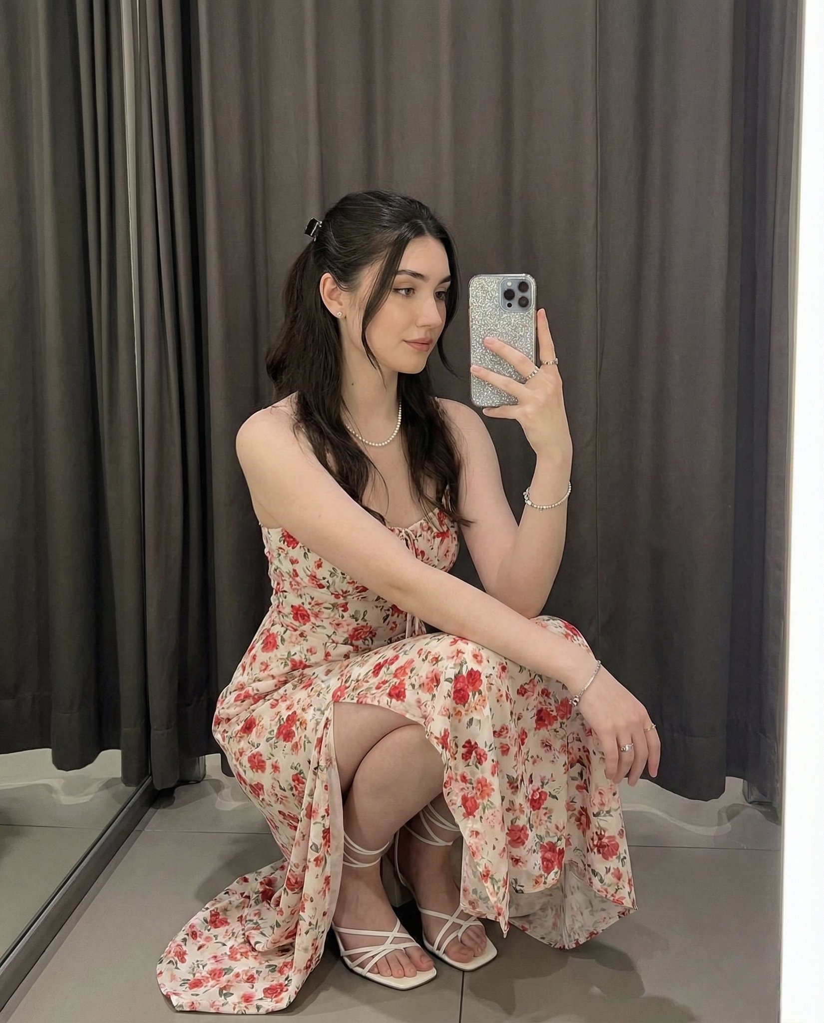 Young Woman Squatting Gracefully for Mirror Selfie